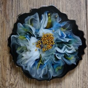 Epoxy resin coaster with blue and green design...
